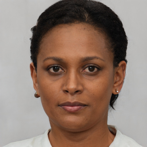 Neutral black young-adult female with short  black hair and brown eyes