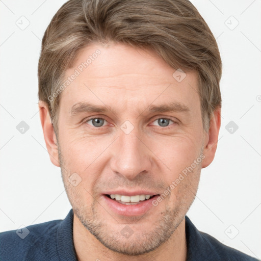 Joyful white adult male with short  brown hair and grey eyes