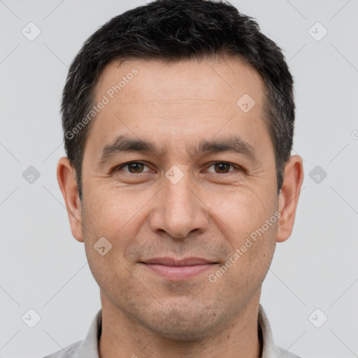 Joyful white adult male with short  brown hair and brown eyes