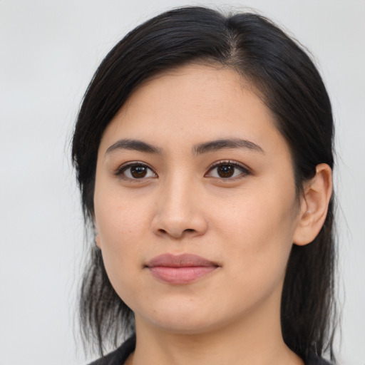 Joyful asian young-adult female with long  black hair and brown eyes