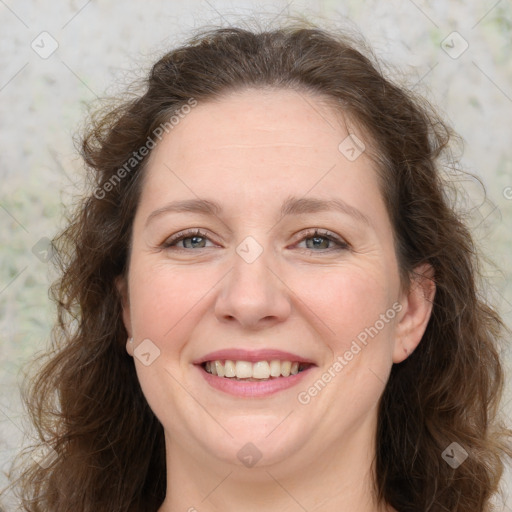 Joyful white adult female with long  brown hair and brown eyes