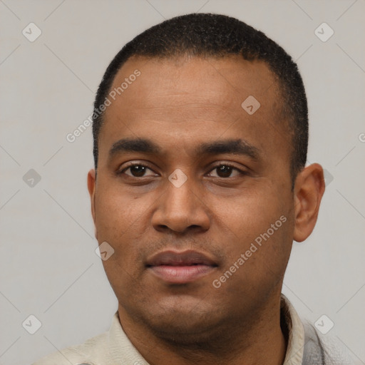 Neutral latino young-adult male with short  black hair and brown eyes