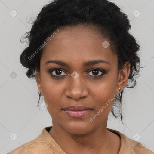 Joyful black young-adult female with medium  black hair and brown eyes