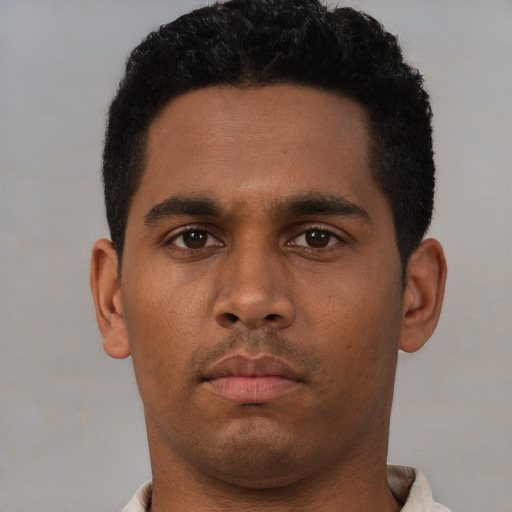 Neutral black young-adult male with short  brown hair and brown eyes