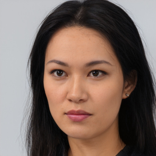 Neutral asian young-adult female with long  brown hair and brown eyes