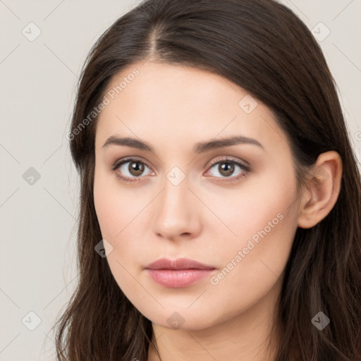 Neutral white young-adult female with long  brown hair and brown eyes