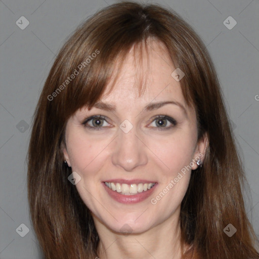 Joyful white adult female with medium  brown hair and grey eyes