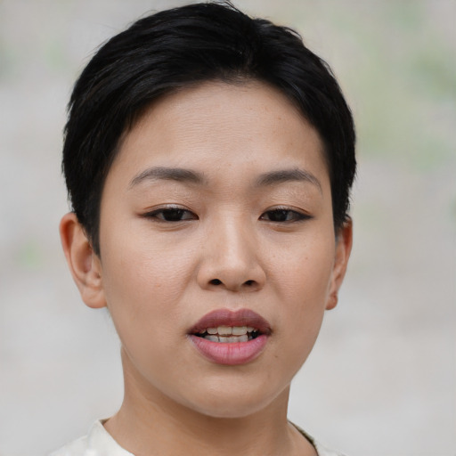 Joyful white young-adult female with short  black hair and brown eyes