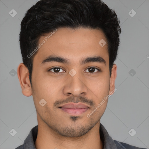 Joyful latino young-adult male with short  black hair and brown eyes