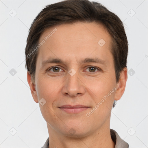 Joyful white adult male with short  brown hair and brown eyes