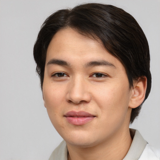Joyful asian young-adult male with medium  brown hair and brown eyes