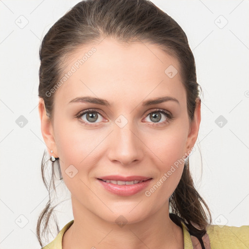 Joyful white young-adult female with medium  brown hair and grey eyes