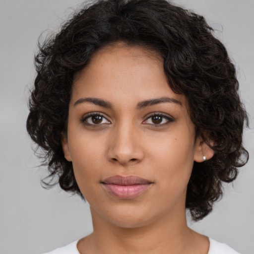 Neutral latino young-adult female with medium  brown hair and brown eyes