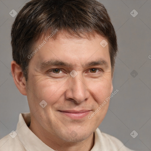 Joyful white adult male with short  brown hair and brown eyes