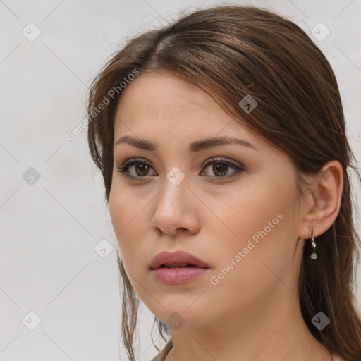 Neutral white young-adult female with long  brown hair and brown eyes