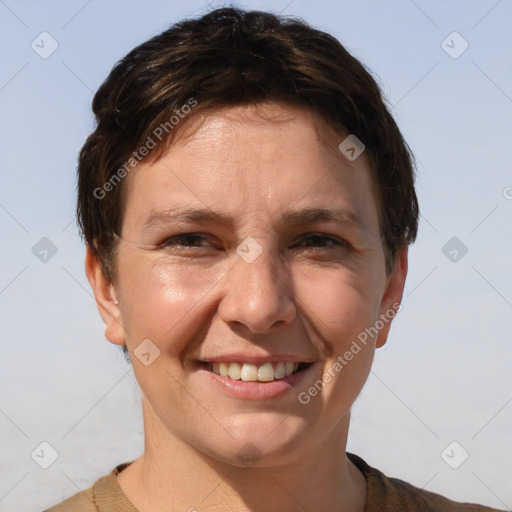 Joyful white adult female with short  brown hair and brown eyes