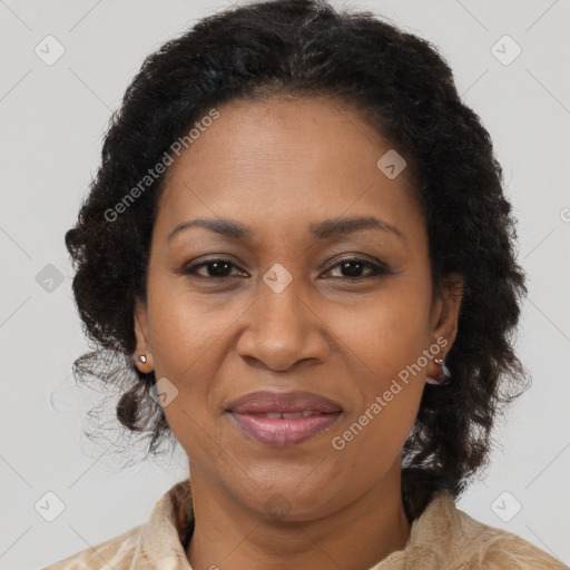 Joyful black adult female with medium  brown hair and brown eyes