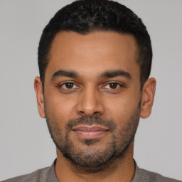 Neutral latino young-adult male with short  black hair and brown eyes