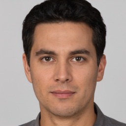 Neutral white young-adult male with short  black hair and brown eyes
