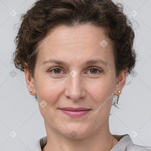 Joyful white adult female with short  brown hair and grey eyes