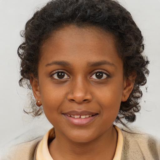 Joyful black child female with medium  brown hair and brown eyes