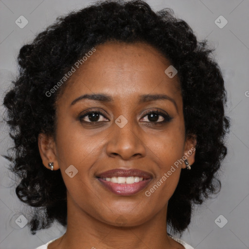 Joyful black young-adult female with medium  brown hair and brown eyes