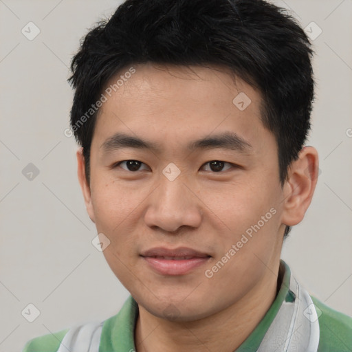 Joyful asian young-adult male with short  black hair and brown eyes