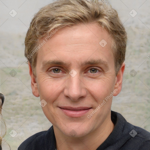 Joyful white adult male with short  brown hair and grey eyes