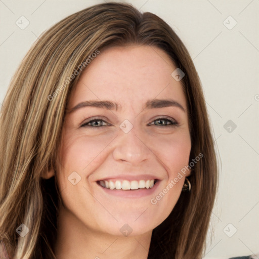 Joyful white young-adult female with long  brown hair and green eyes