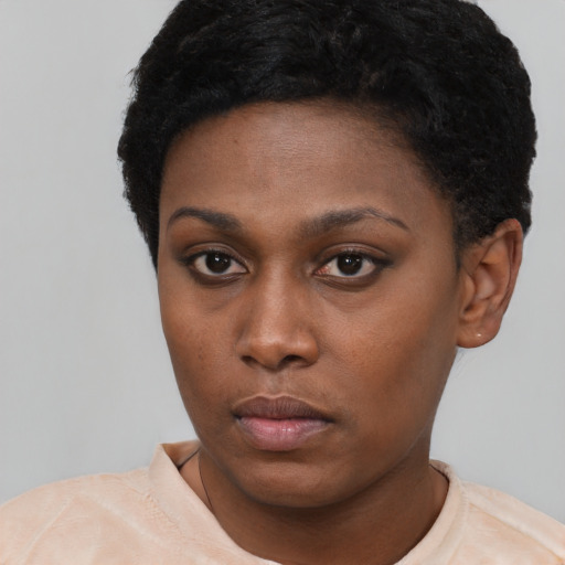 Neutral black young-adult female with short  black hair and brown eyes