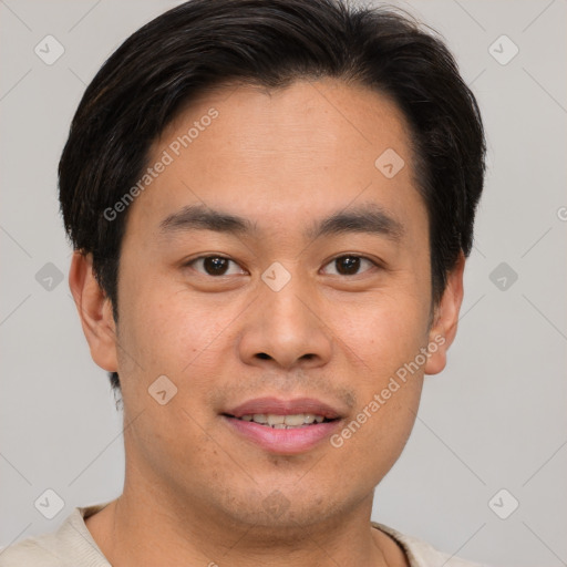 Joyful asian young-adult male with short  brown hair and brown eyes