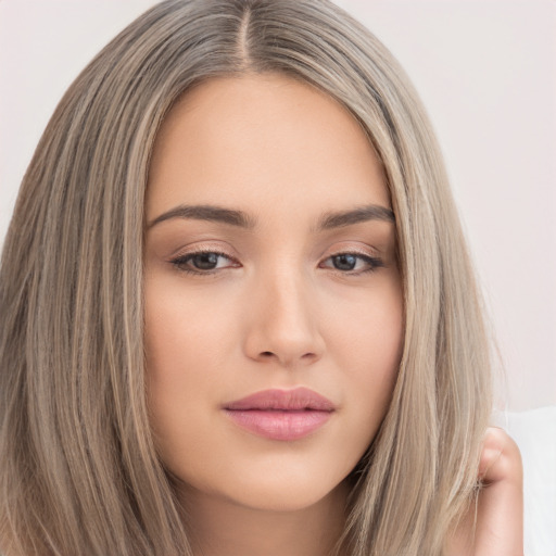 Neutral white young-adult female with long  brown hair and brown eyes