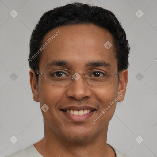 Joyful black young-adult male with short  black hair and brown eyes