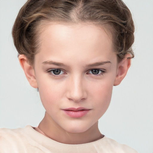 Joyful white child female with short  brown hair and grey eyes