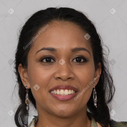 Joyful black young-adult female with long  brown hair and brown eyes