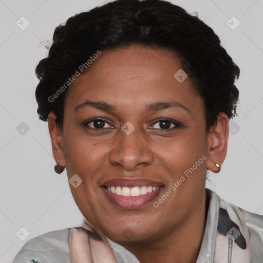 Joyful latino adult female with short  black hair and brown eyes