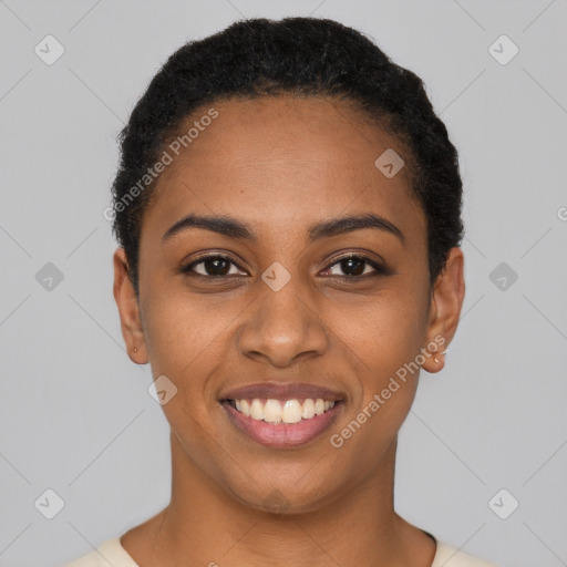 Joyful black young-adult female with short  black hair and brown eyes