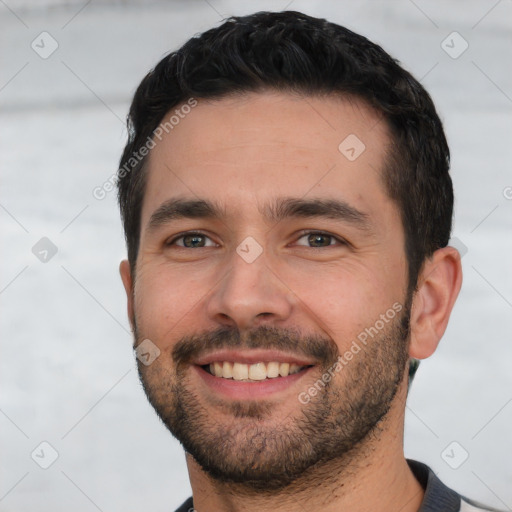 Joyful white young-adult male with short  black hair and brown eyes