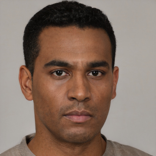 Neutral black young-adult male with short  black hair and brown eyes