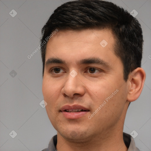 Joyful white young-adult male with short  black hair and brown eyes