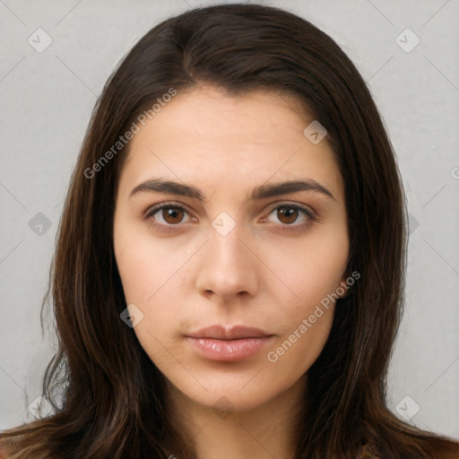 Neutral white young-adult female with long  brown hair and brown eyes