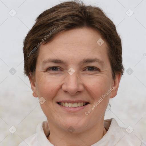 Joyful white adult female with short  brown hair and grey eyes