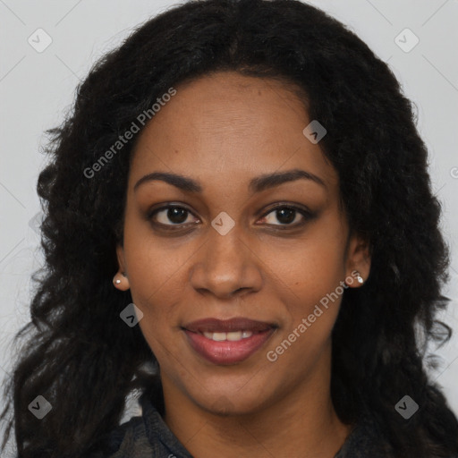 Joyful black young-adult female with long  black hair and brown eyes