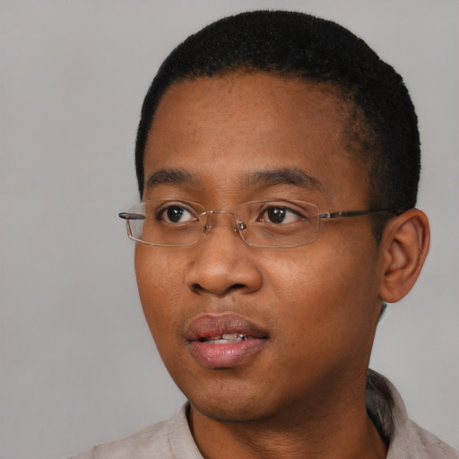 Neutral black young-adult male with short  black hair and brown eyes