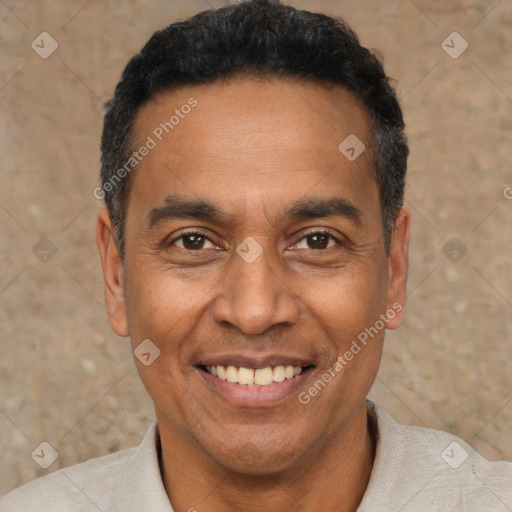 Joyful latino adult male with short  black hair and brown eyes