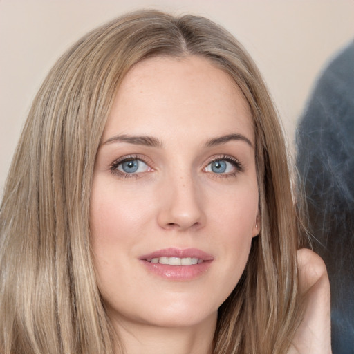 Joyful white young-adult female with long  brown hair and grey eyes