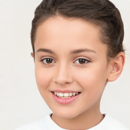 Joyful white child female with short  brown hair and brown eyes