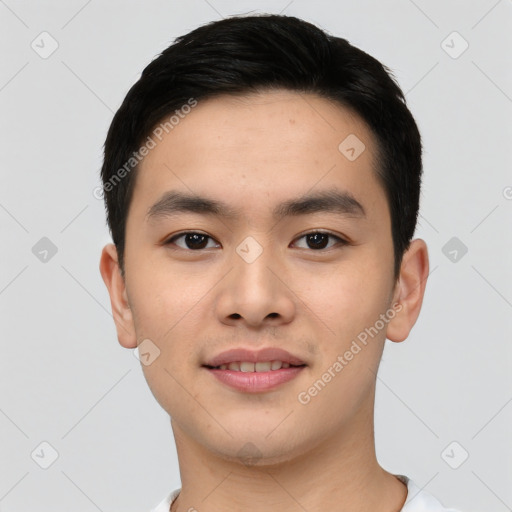 Joyful asian young-adult male with short  black hair and brown eyes