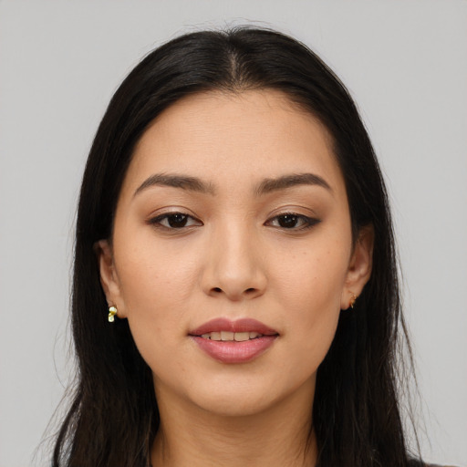 Joyful white young-adult female with long  black hair and brown eyes