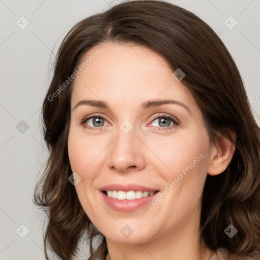 Joyful white young-adult female with medium  brown hair and green eyes